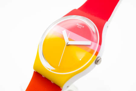 New York, NY, USA 07.10.2020 - Swatch childrens cheapest swiss made quartz watch isolated on white background close up. colored plastic case youth hipster style watch for bright imageのeditorial素材