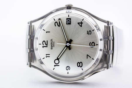 London, GB 07.10.2020 - Swatch classic design swiss made mechanical watch close up. transparent plastic case and bracelet, stylish trendy womens accessory. Swatch Group watch production.のeditorial素材