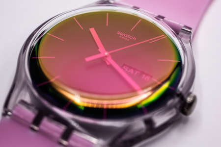 Paris, France 07.10.2020 - Swatch swiss made quartz watch isolated on white backdrop. transparent plastic case, Fluorescent colors youth hipster style watch for bright image. Swatch Group. Saturday 18のeditorial素材