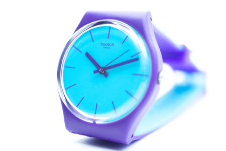 Paris, France 07.10.2020 - Swatch swiss made quartz watch isolated on white background close up. colored plastic case Fluorescent colors, youth hipster style watch for bright image. Swatch Groupのeditorial素材