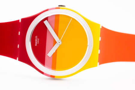 New York, NY, USA 07.10.2020 - Swatch childrens cheapest swiss made quartz watch isolated on white background close up. colored plastic case youth hipster style watch for bright image.のeditorial素材