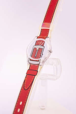 Rome, Italy 07.10.2020 - Swatch childrens trendy fashion swiss made quartz watch isolated on white. plastic case, red strap, youth hipster style watch for bright image. transparent freak designのeditorial素材