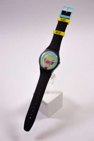 Geneve, Switzerland 07.10.2020 - Swatch childrens swiss made plastic watch on stand, ostrich head on dial. youth hipster style watch for bright image. Swatch Group watch productionのeditorial素材