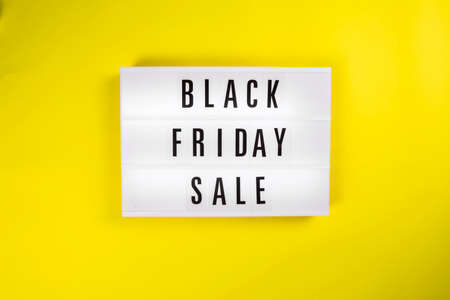 Black Friday Sale message on lightbox on yellow background isolated. Concept Black friday, season sales time. Sales, special offers, discounts, elimination of last years collection conceptの写真素材