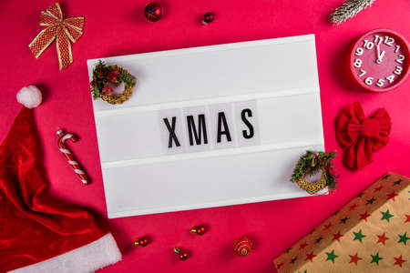 Xmas word on lightbox on Christmas decorated bacground Christmas and New Years Eve, Christmas vacations, gifts conceptの写真素材