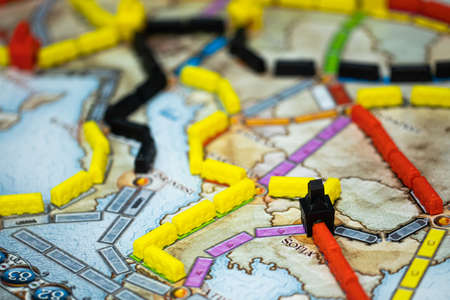 London, GB 11.02.2021 - Close-up view of popular family railway-themed board game - Ticket to Ride...