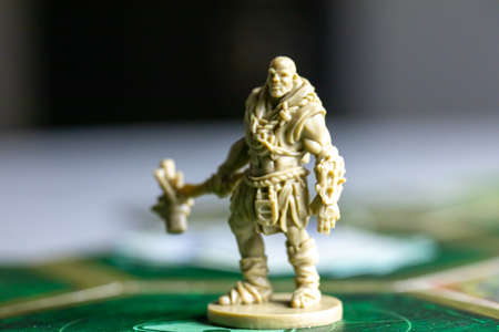 Roseville, MN, USA, 02.04.2021 - Fallout Board Game Plastic Figure standing on Map Tiles selective focus close up. four players Home entertainment Based on post-apocalyptic computer game Falloutの写真素材