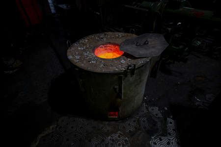 Production of aluminum from waste at outdated foundry. Technologies of 20th century and ideas of zero-waste production of 21st century. New Era Overcomes Old Industrial Traditionsの写真素材