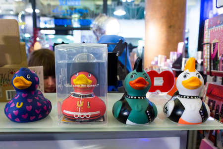 Paris, France, 1.11.2019 - Fashionable stylish designer rubber duckies in royal guard, punk and Mohawk looks made in plastic on counter of gift store. Rubbers duck with differenceのeditorial素材