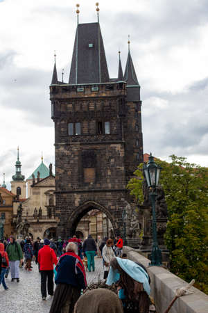 Prague, Czech Republic, 2.09.2020 - Old Tower of Charles Bridge, actors on filming historical movie on foreground. Tours of Old Prague, travel concept, heritage of medieval Europeのeditorial素材