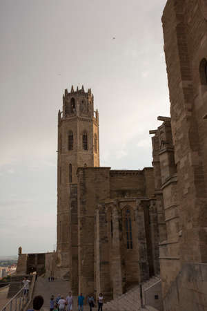 Lleida, Spain, May 1, 2020 - tower and fortress wall of La Seu Vella former Roman Catholic cathedral church under thunderclouds. Symbol of Reconquista, historical struggle between Moors and Christiansのeditorial素材
