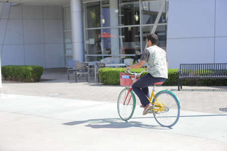 Mountain View, CA, US, 2.09.2020 - Google employee riding bicycle on Googleplex area, main Google campus in Silicon Valley, south San Francisco bayのeditorial素材