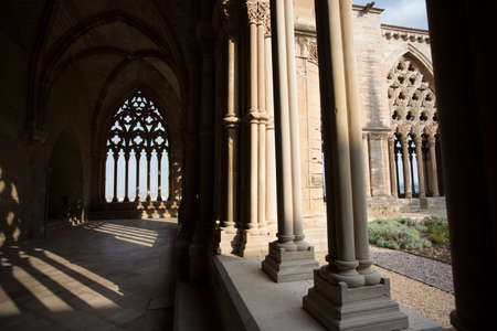 Lleida, Spain, May 1, 2020 - Typical Gothic architecture La Seu Vella cathedral: vaults, colonnade, windows, arches of Cloister part Medieval Roman Catholic cathedral church de Santa Mariaのeditorial素材