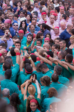 Tarragona, Spain, September 19, 2019 - Preparation for erection of human tower castell, faces and emotions of castellers close up. Castells performance during Sant Magi Festival de Tarragonaのeditorial素材
