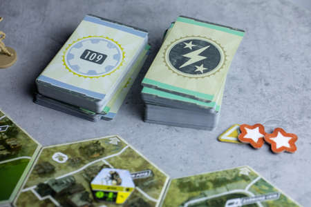 Roseville, MN, USA, 02.04.2021 - Fallout post-apocalyptic Board Game components Encounter Cards,...