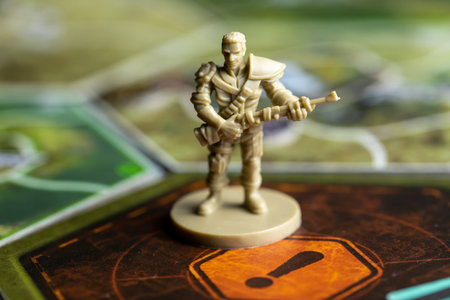 Roseville, MN, USA, 02.04.2021 - Fallout Board Game Plastic Enemy Figure on facedown and faceup Map...