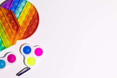 Pop It Simple Dimple - silicone sensory anti-stress Fidget toy colorful rainbow game isolated on...