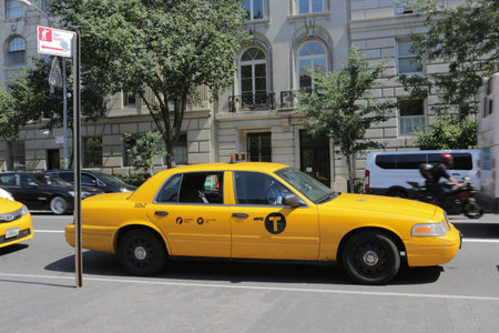 New York City, NY, USA 2.09.2020 - Yellow cab waiting on taxi stand in Manhattan. Metered fare, flat JFK fare. NYC taxi. Yellow cab cars are recognizable symbol of New York Cityのeditorial素材