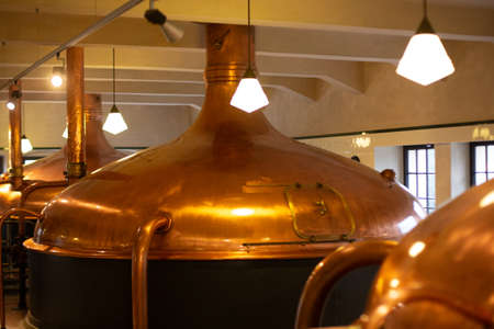 Pilsen, Czech Republic, 1.09.2019 - vintage copper brewery boilers, interior of Pilsner Urquell Museum. Beer background. Retro style. Beer brewing traditionsのeditorial素材