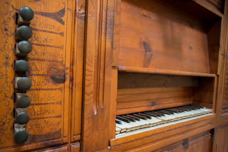Lleida, Spain, May 1, 2020 - register control and keyboard of medieval organ of La Seu Vella cathedral. Religious music, church acoustics, ancient musical instrument concept.のeditorial素材
