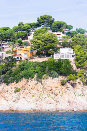 Lloret de Mar, Spain, May 1, 2020 - Private villas on high Costa Brava rocky coast. Mediterranean architecture, villas overlooking Balearic sea. Popular tourist destination in Catalonia.のeditorial素材
