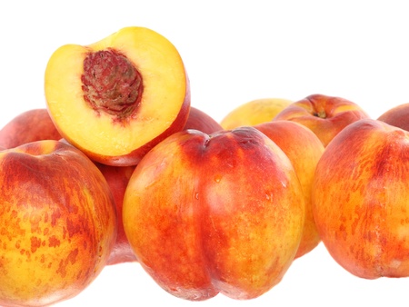 A few peaches with slice of one, on white background. Isolatedの写真素材
