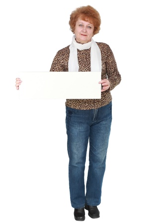 Senior lady standing with blank card. Isolated over whiteの写真素材