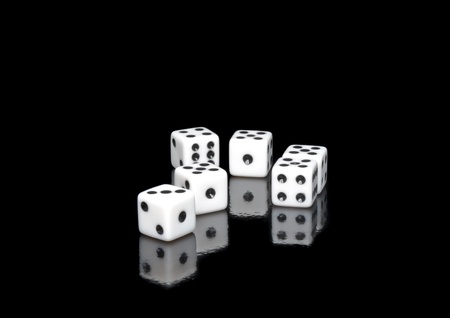 The dices on  black background.