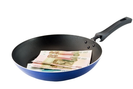 Frying pan with the russians moneys- roubles. Fried money.Top view. Isolatedの写真素材