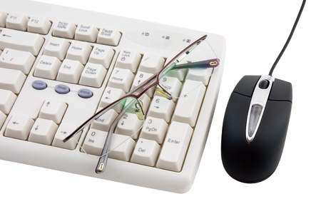 Black computer mouse and part of keyboard on white background. Isolated.の写真素材