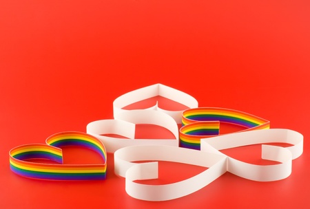 A lot of hearts gay and straight on red background.