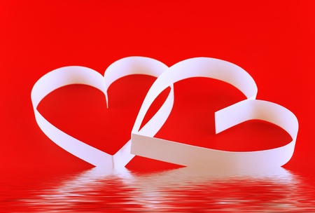 St. Valentine Day. Two hearts,on red background.の写真素材