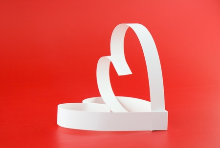 St. Valentine Day. Two hearts,on red background.