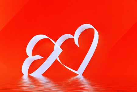 St. Valentine Day. Two hearts,on red background.