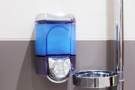 Faucet with soap dispenser in bathroom.の写真素材