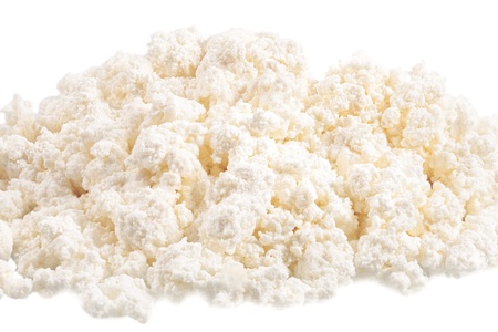 Fresh cottage cheese  curd  heap, isolated on white background の写真素材