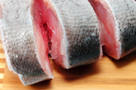 Slices of raw carp  on a white background Isolatedの写真素材