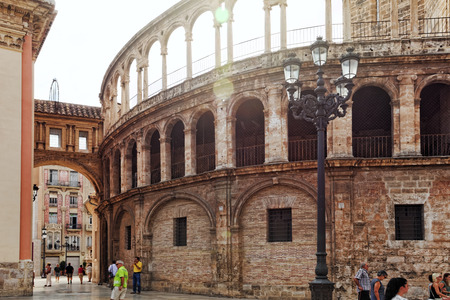 VALENCIA, SPAIN - SEPT 10: Square of Saint Mary's and Valencia  Cathedral Temple in old town. September 10, 2014 in Valencia, Spain. Every year,Valencia(third size population  city in Spain)welcomes more than 4 million visitors.のeditorial素材