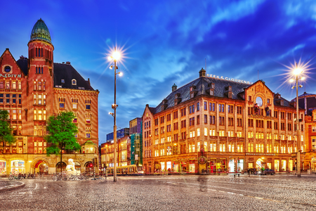 AMSTERDAM, NETHERLANDS - SEPTEMBER 15, 2015: Beautiful Amsterdam, centre of  Dam Square in the evening. Square is a central place for local inhabitants and tourists of the Dutch capital. Netherlandsのeditorial素材