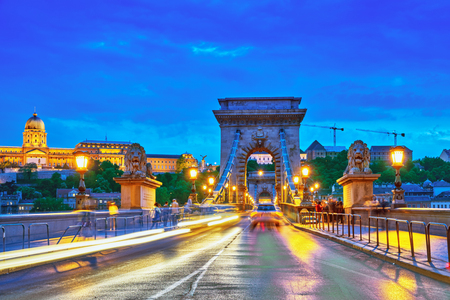 Budapest Royal Castle and Szechenyi Chain Bridge at dusk time. Hungary.の写真素材
