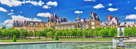 Suburban Residence of the France Kings - beautiful Chateau Fontainebleau with the fountain on foreground.のeditorial素材