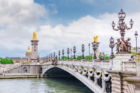 PARIS, FRANCE- JULY 01, 2016 : Bridge of Alexandre III bridge (1896) spanning the river Seine. Decorated with ornate Art Nouveau lamps and sculptures. Paris. France.のeditorial素材