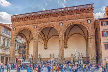 FLORENCE, ITALY- MAY 13, 2017:  Piazza della Signoria, Loggia Della Signoria (Loggia dei Lanzione) of the most famous buildings of the city. Torists around.のeditorial素材