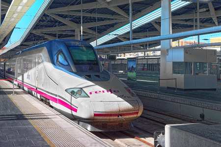 Valencia, Spain - June 13, 2017 : North Railways Station (Estacio del Nord) and modern hi-speed passenger train of Spanish railways company - Renfe.のeditorial素材