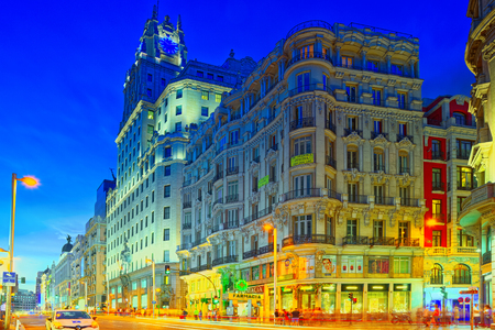 Madrid, Spain - June 04, 2017 : Gran Via Street in Madrid, after sunset, traffic lights on Gran Via, main shopping and  financial street in Madrid at night.のeditorial素材