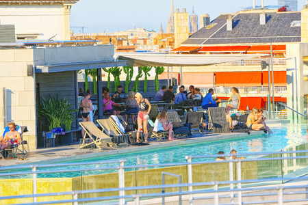 Barcelona, Spain - June 12, 2017 : Panorama on the urban center of Barcelona, the capital of the Autonomy of Catalonia. Pool on the roof with people.のeditorial素材