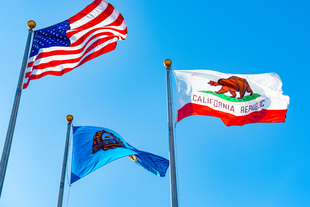 Three flags in front of Beverly Hills City Hall. Los Angelos, California, USA.
