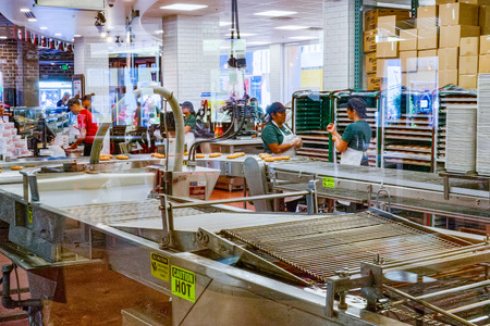 San Francisco,  California, USA - September 09, 2018: Production process of donuts in one of the...