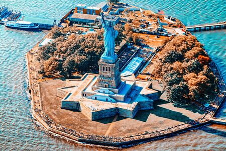 Fly over, view Statue of Liberty (Liberty Enlightening the world) near New York and Manhattan from a bird's eye view.の写真素材