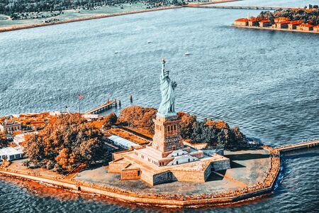 Fly over, view Statue of Liberty (Liberty Enlightening the world) near New York and Manhattan from a bird's eye view.の写真素材
